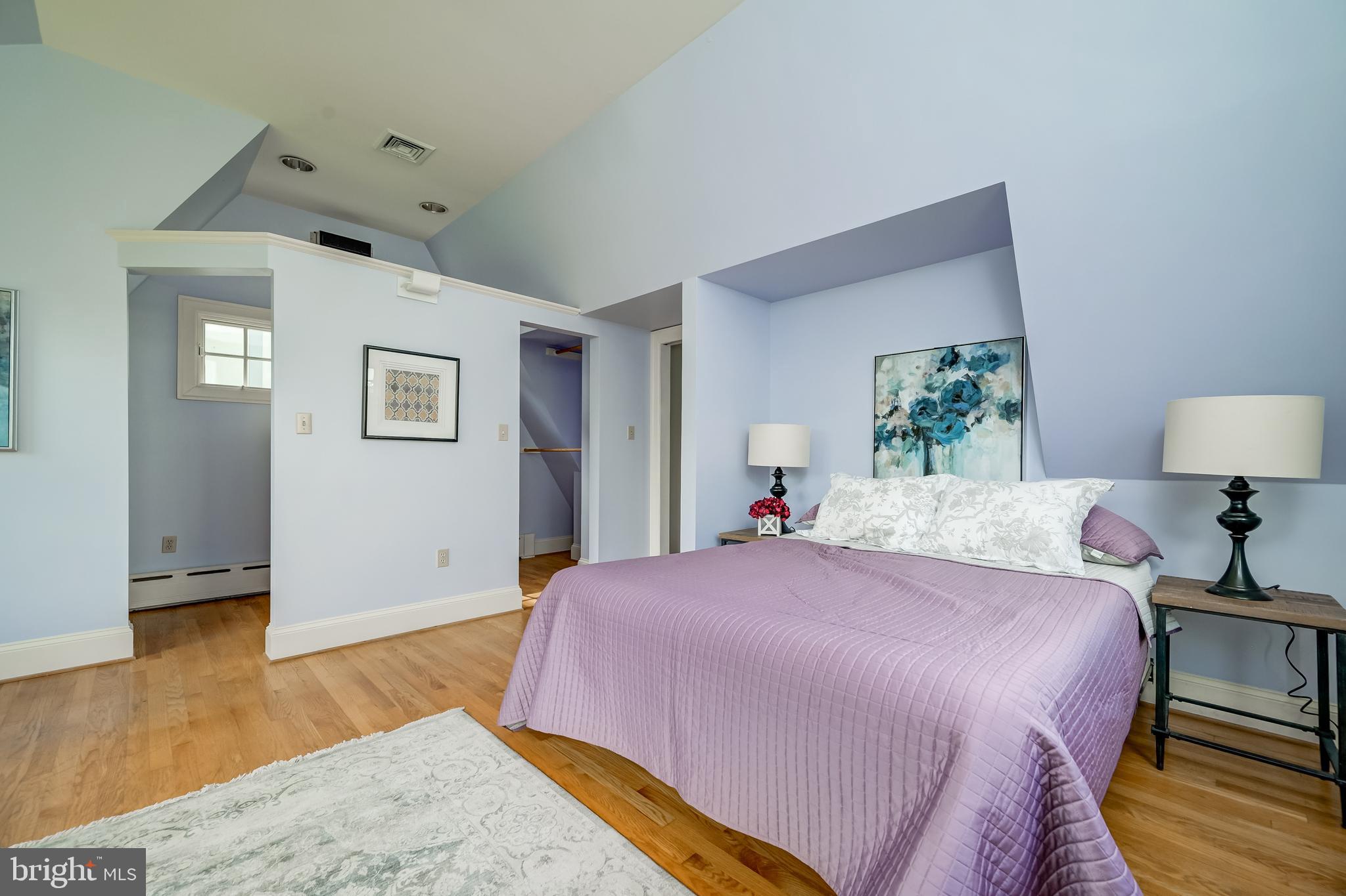 3608 Spring Street Chevy Chase, MD 20815 - Photo 28 of 38 a bedroom with a bed and wooden floor