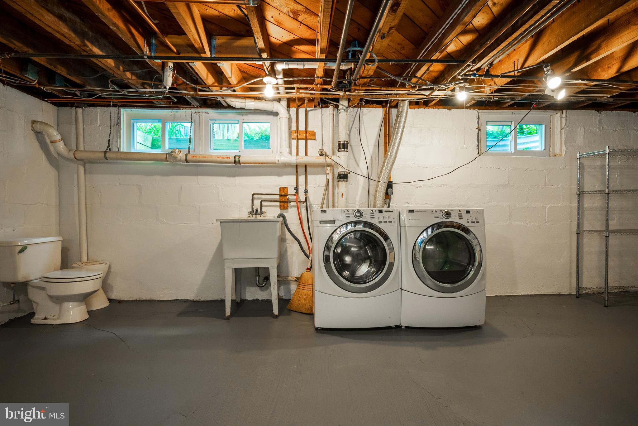 3608 Spring Street Chevy Chase, MD 20815 - Photo 30 of 38 a utility room with dryer and washer