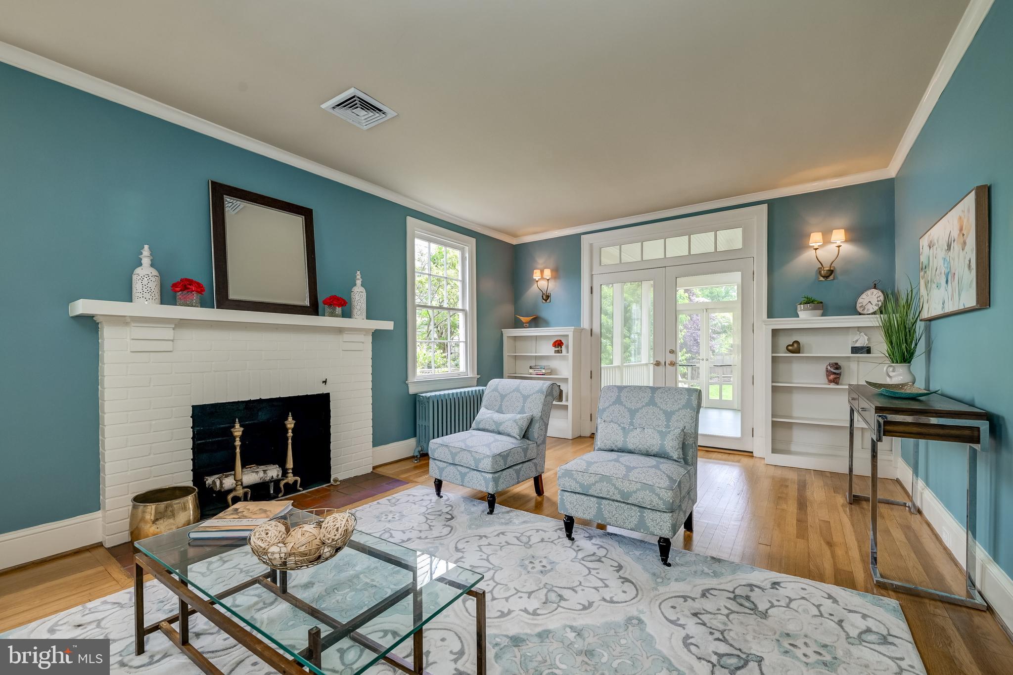 3608 Spring Street Chevy Chase, MD 20815 - Photo 8 of 38 a living room with furniture and a fireplace