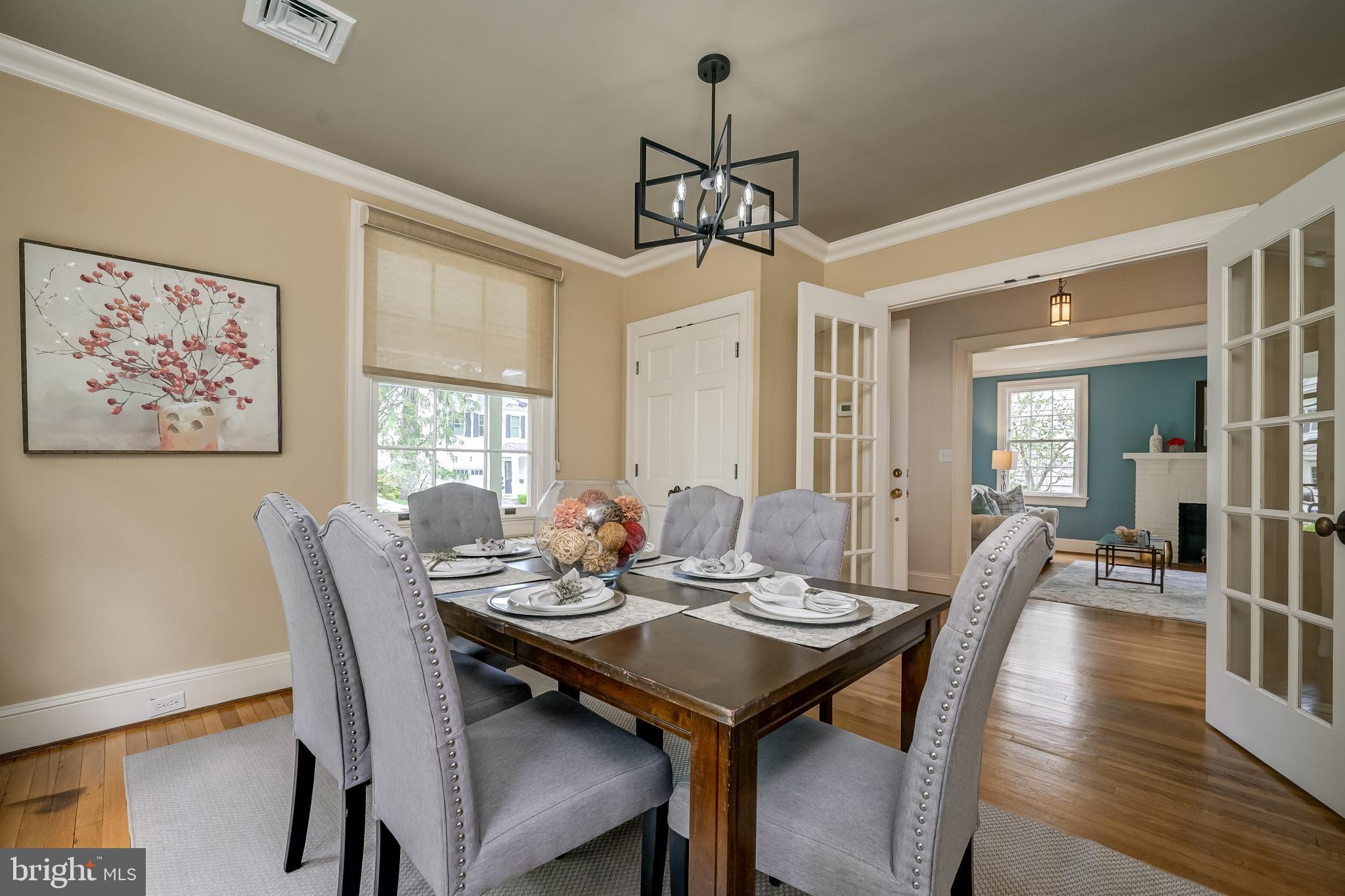 3608 Spring Street Chevy Chase, MD 20815 - Photo 9 of 38 a view of a dining room with furniture window and wooden floor