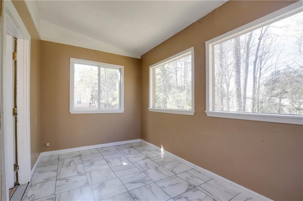 7043 Ivy Pointe Row Austell, GA 30168 - Photo 15 of 36 a view of an empty room with a window