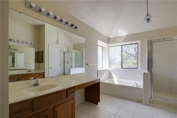 a spacious bathroom with a double vanity sink mirror and