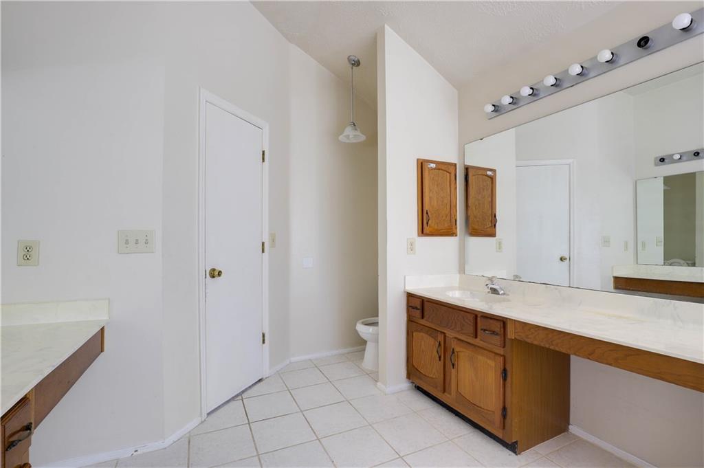 7043 Ivy Pointe Row Austell, GA 30168 - Photo 28 of 36 a spacious bathroom with a double vanity sink mirror and