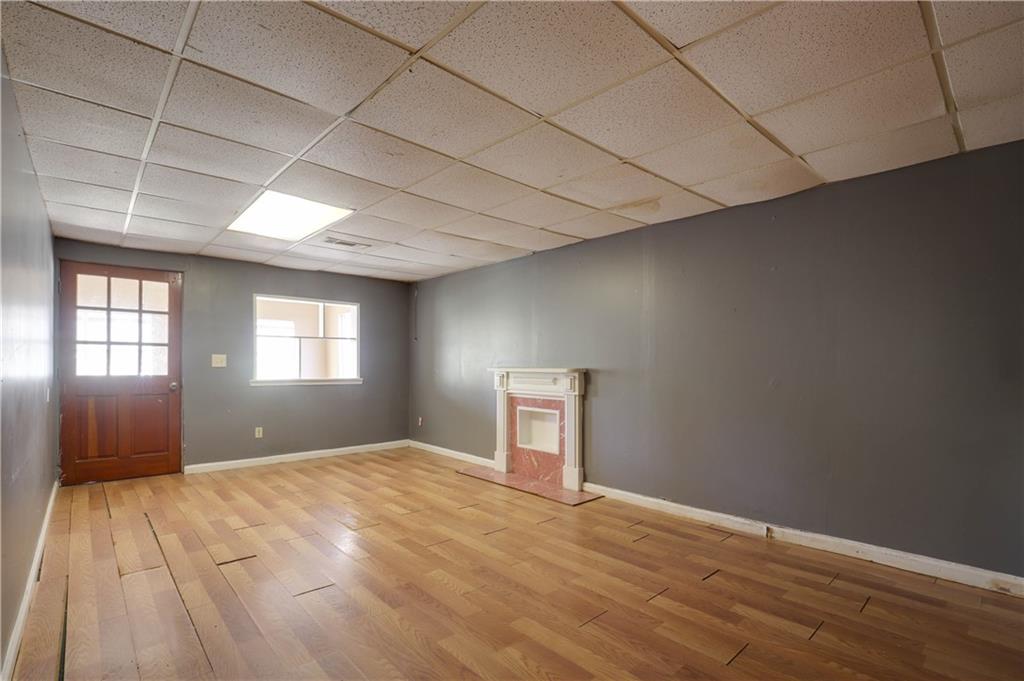 7043 Ivy Pointe Row Austell, GA 30168 - Photo 29 of 36 a view of empty room with wooden floor and fan