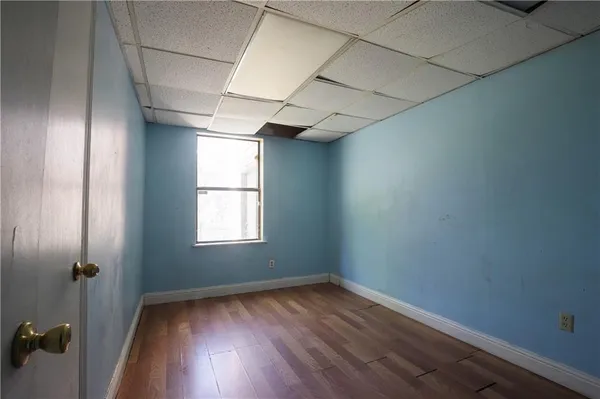 a view of hallway with wooden floor