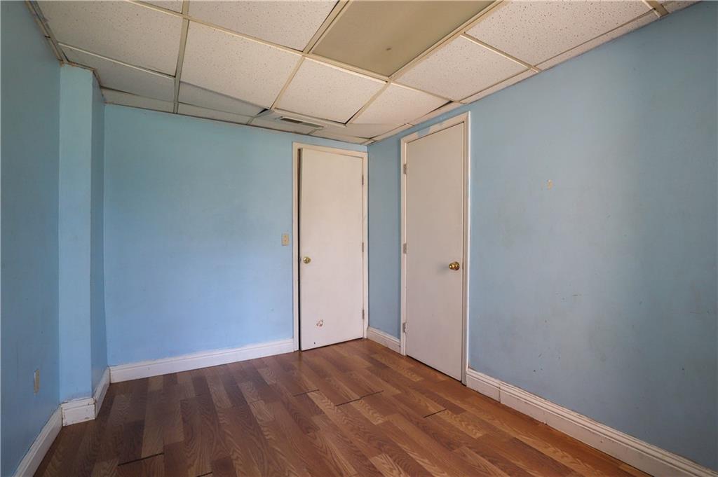 7043 Ivy Pointe Row Austell, GA 30168 - Photo 33 of 36 a view of hallway with wooden floor