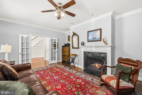 a dining room with furniture and wooden floor