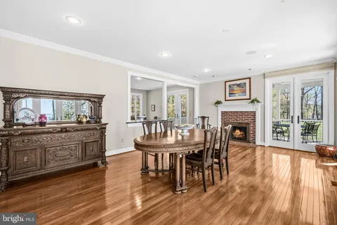 a spacious bedroom with a bed and glass window