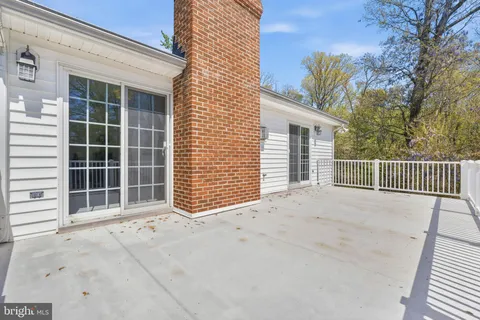 a bathroom with double vanity sinks and a mirror