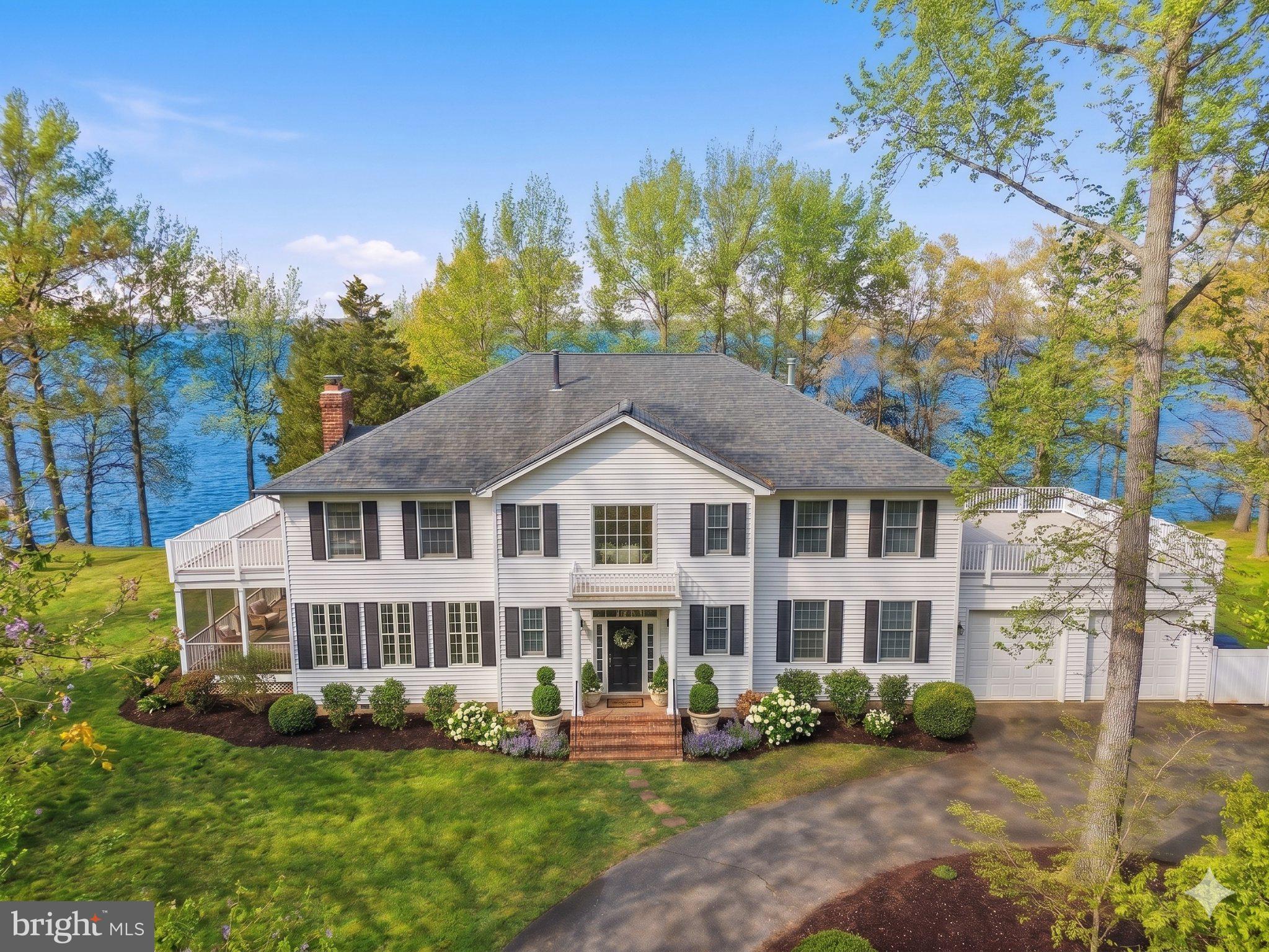 1325 Liverpool Point Road Nanjemoy, MD 20662 - Photo 4 of 76 Charming lakeside retreat with lush greenery.