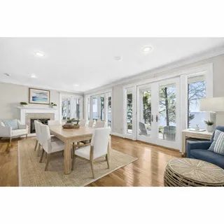 a kitchen that has a table and chairs in it