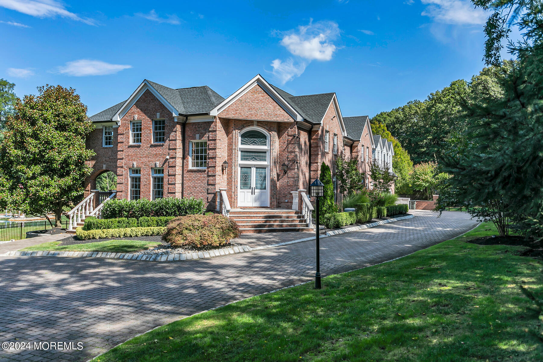 147 Heulitt Road Colts Neck, NJ 07722 - Photo 1 of 49 a front view of a house with a yard and garage