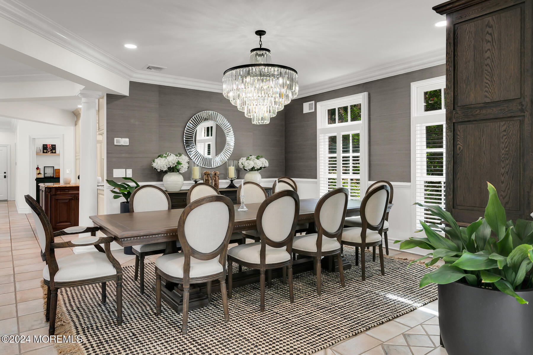 147 Heulitt Road Colts Neck, NJ 07722 - Photo 14 of 49 a dining room with furniture a chandelier and wooden floor