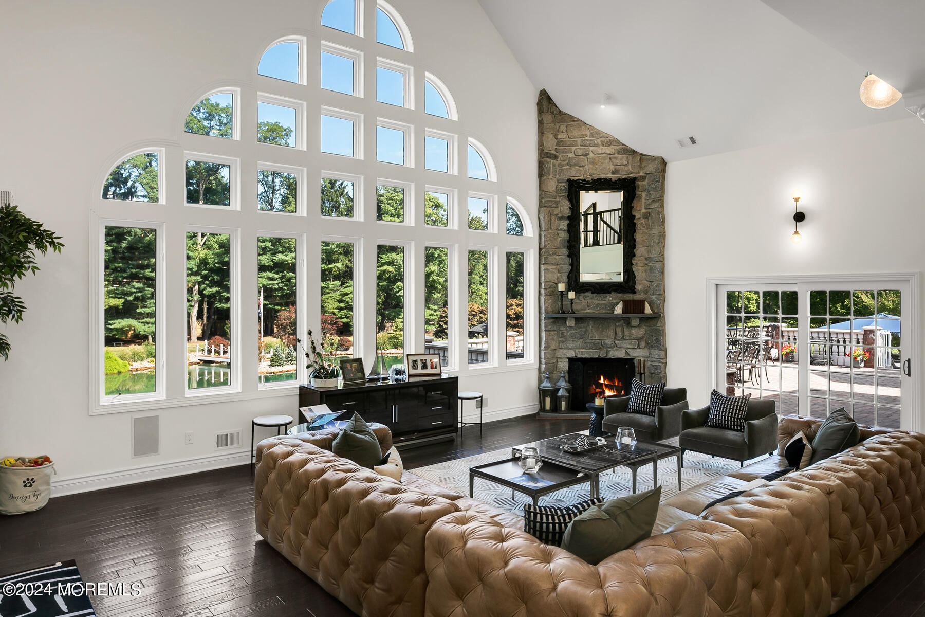 147 Heulitt Road Colts Neck, NJ 07722 - Photo 15 of 49 a living room with furniture fireplace and a large window