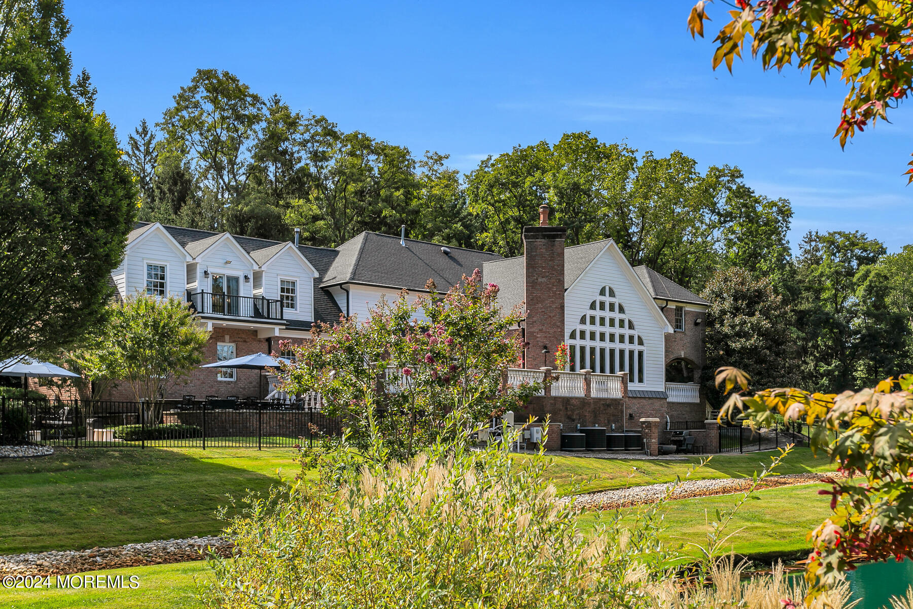 147 Heulitt Road Colts Neck, NJ 07722 - Photo 2 of 49 a front view of a house with a garden