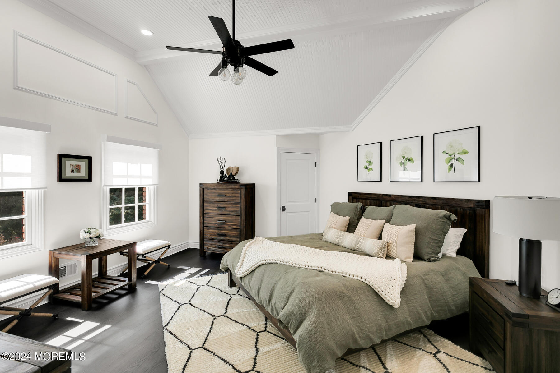 147 Heulitt Road Colts Neck, NJ 07722 - Photo 24 of 49 a spacious bedroom with a bed a couch and a flat screen tv