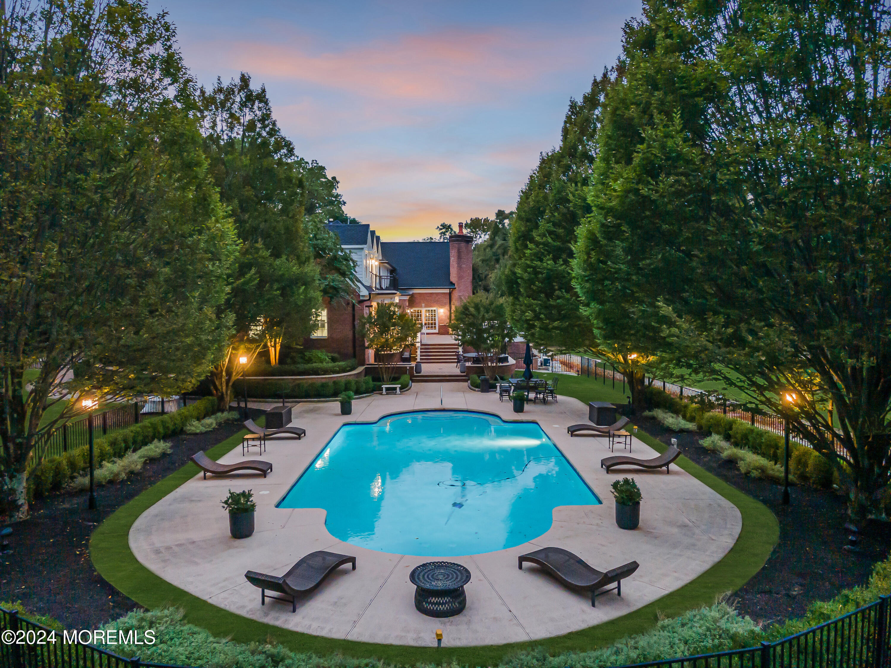 147 Heulitt Road Colts Neck, NJ 07722 - Photo 3 of 49 a view of a swimming pool with sitting area
