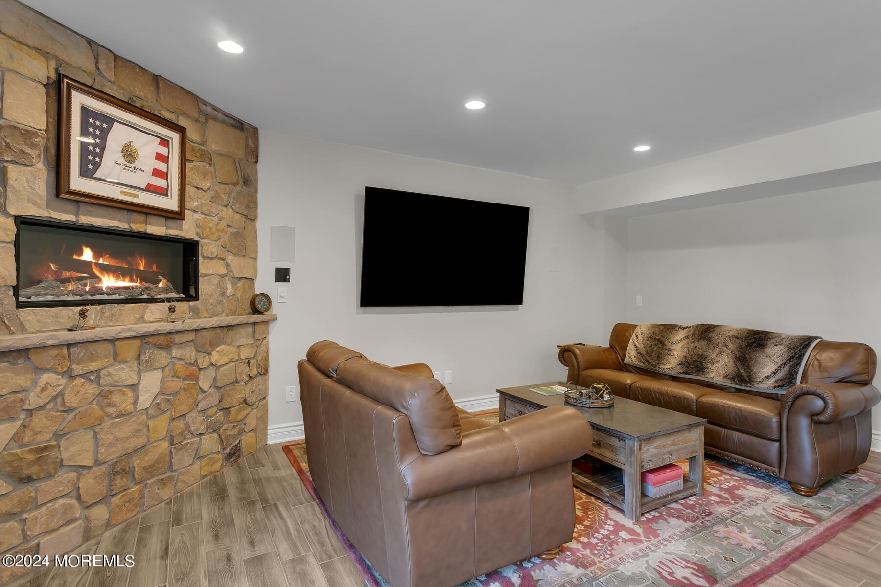 147 Heulitt Road Colts Neck, NJ 07722 - Photo 40 of 49 a living room with furniture and a flat screen tv