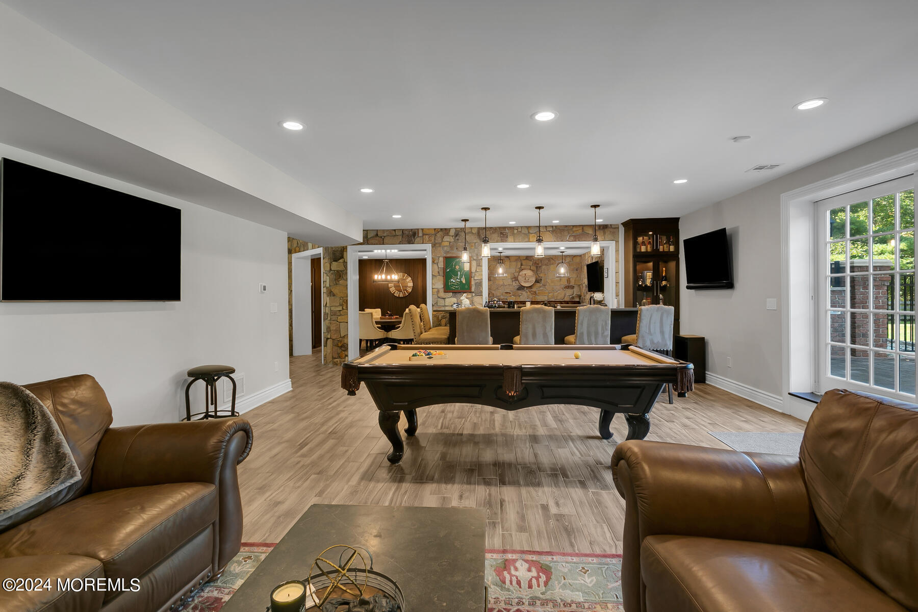 147 Heulitt Road Colts Neck, NJ 07722 - Photo 41 of 49 a living room with furniture and a flat screen tv