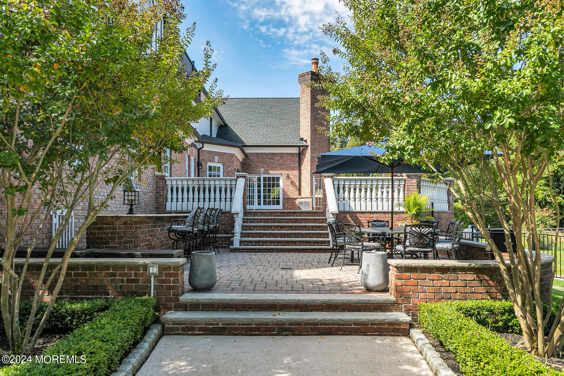 147 Heulitt Road Colts Neck, NJ 07722 - Photo 45 of 49 a front view of a house with a garden