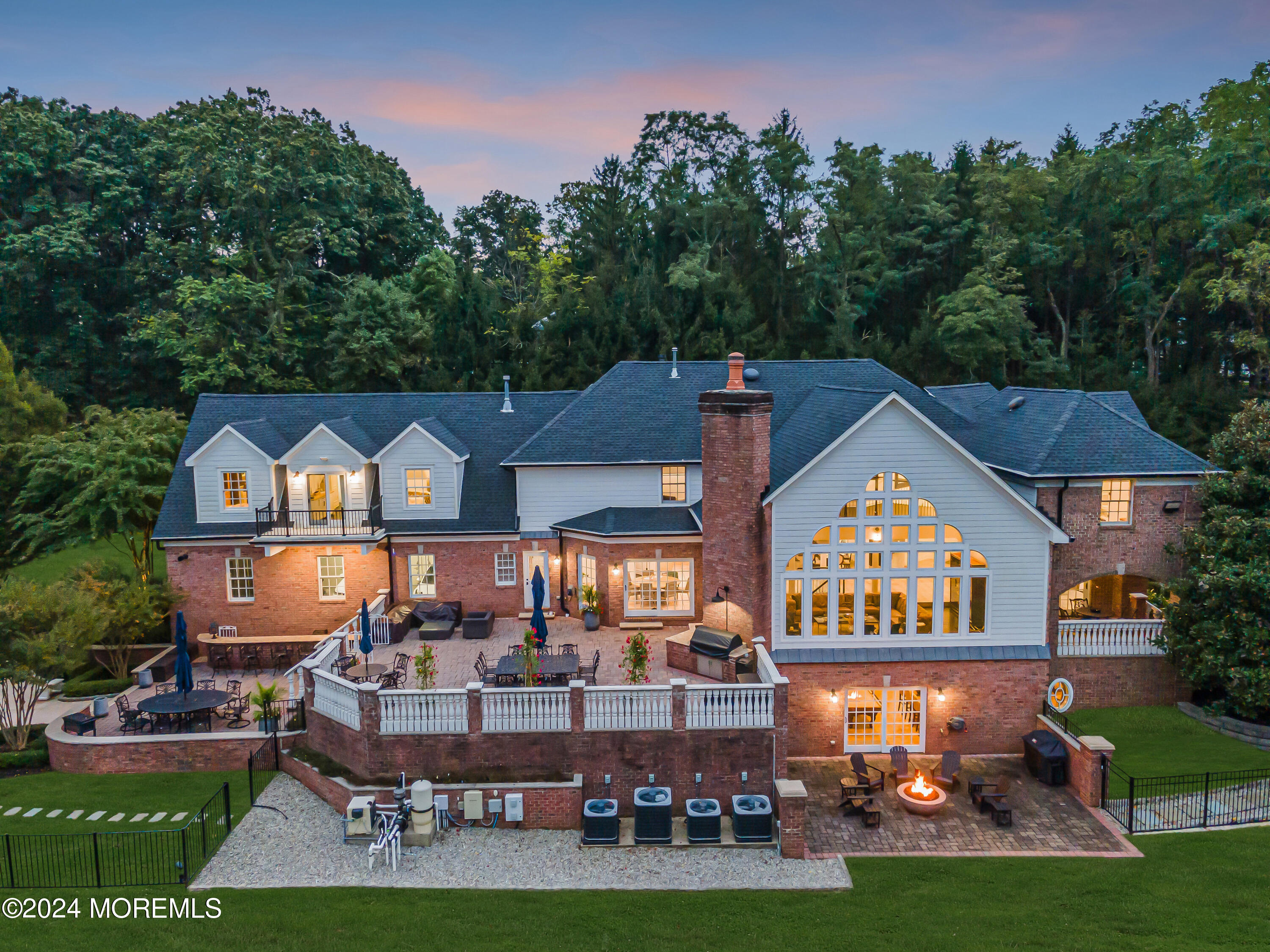 147 Heulitt Road Colts Neck, NJ 07722 - Photo 47 of 49 a front view of a house with garden and trees