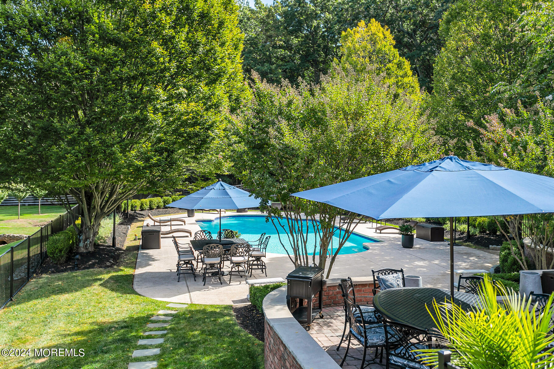 147 Heulitt Road Colts Neck, NJ 07722 - Photo 6 of 49 a view of house with swimming pool and outdoor seating