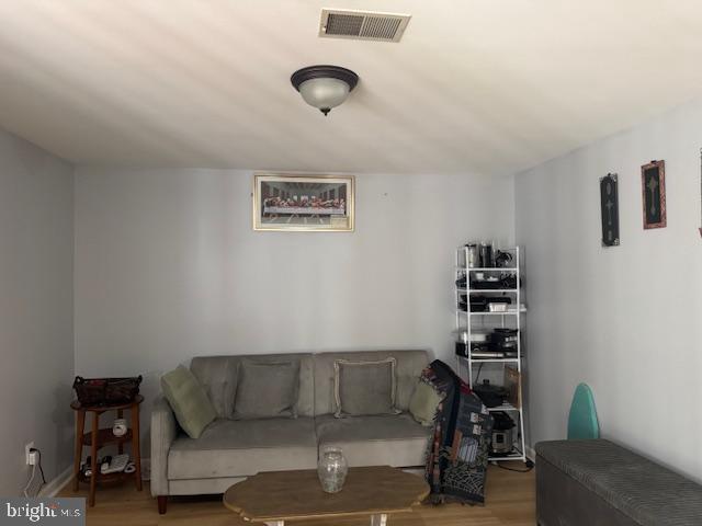 17929 Milroy Drive Dumfries, VA 22026 - Photo 8 of 8 a living room with furniture and a couch