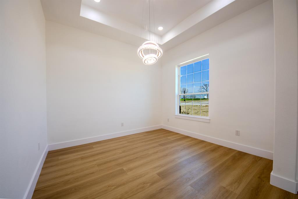 1001 Henry Way Springtown, TX 76082 - Photo 6 of 36 Formal Dining with Elegant Lighting