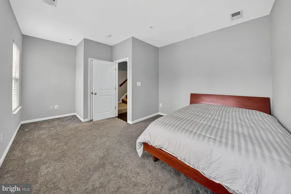 a bedroom with a bed and closet