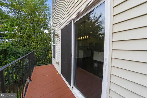 a balcony view with a glass door