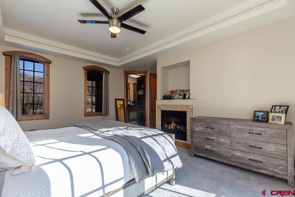 a bedroom with a bed and a fireplace