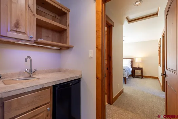 a en suite bathroom with a sink a mirror and a toilet