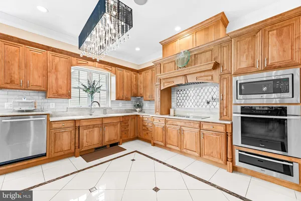a work room with furniture a large window and a table