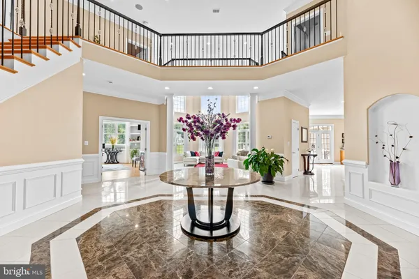 a kitchen with stainless steel appliances granite countertop a sink a cabinets and next to a window