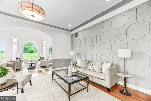 a bathroom with a granite countertop sink toilet and a mirror