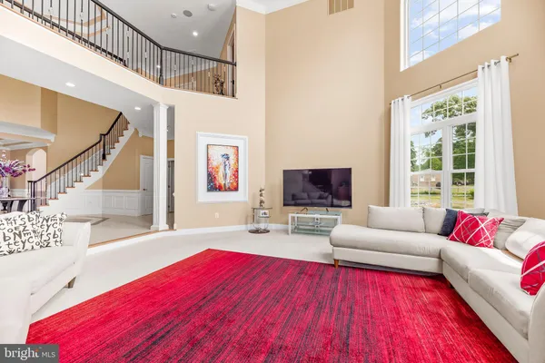 a dining room with stainless steel appliances kitchen island a table and chairs