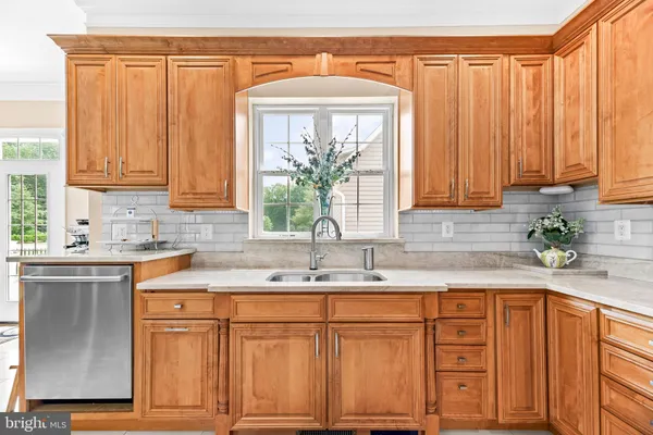 a view of a house with a yard and sitting area