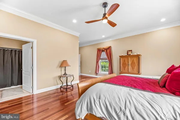 an aerial view of a house with a yard and trees