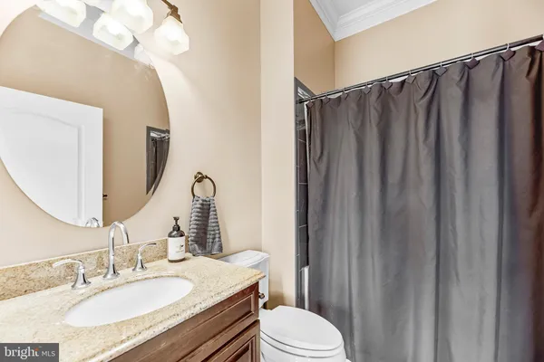 an aerial view of a house with a garden and swimming pool