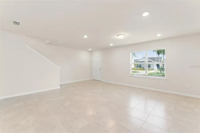 an empty room with wall and window