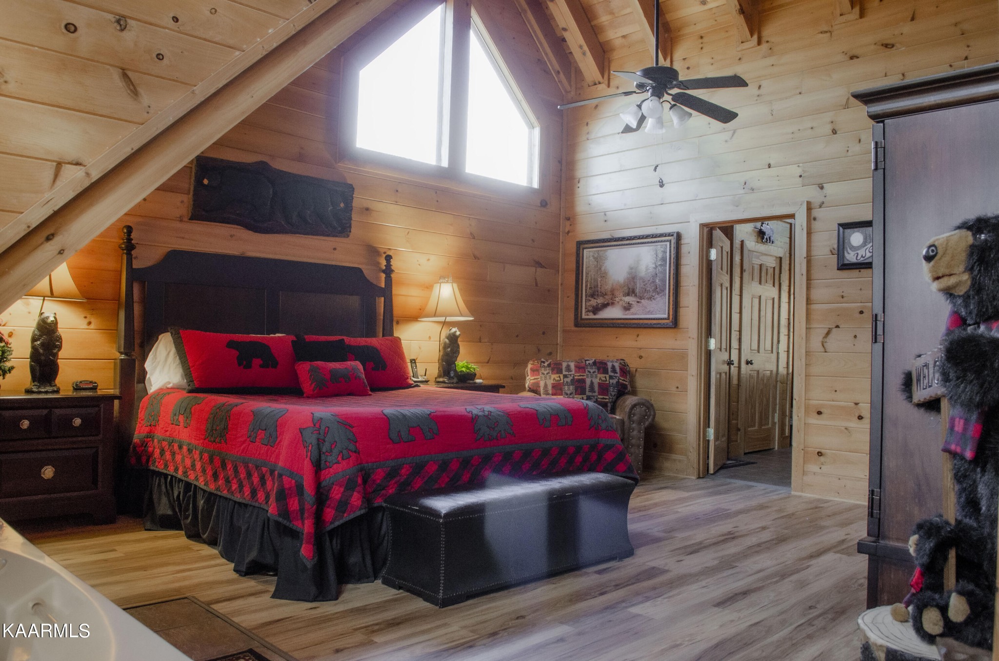 1304 Timberwolf Way Sevierville, TN 37876 - Photo 20 of 36 a bedroom with a bed and a table