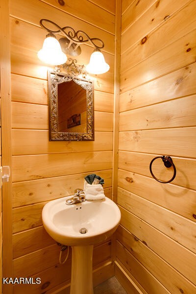 1304 Timberwolf Way Sevierville, TN 37876 - Photo 26 of 36 a bathroom with a sink and mirror