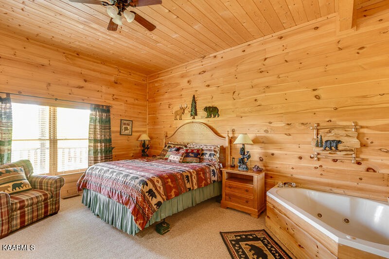 1304 Timberwolf Way Sevierville, TN 37876 - Photo 27 of 36 a bedroom with a bed couch and window