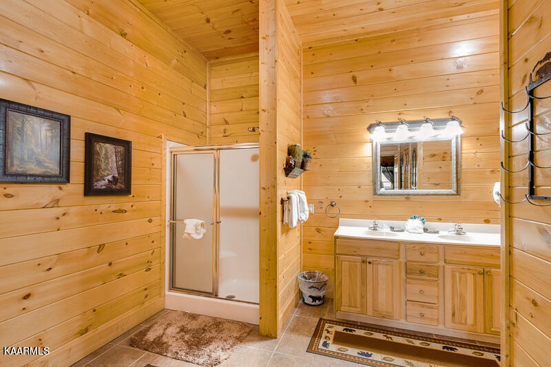 1304 Timberwolf Way Sevierville, TN 37876 - Photo 29 of 36 a bathroom with a sink and a mirror