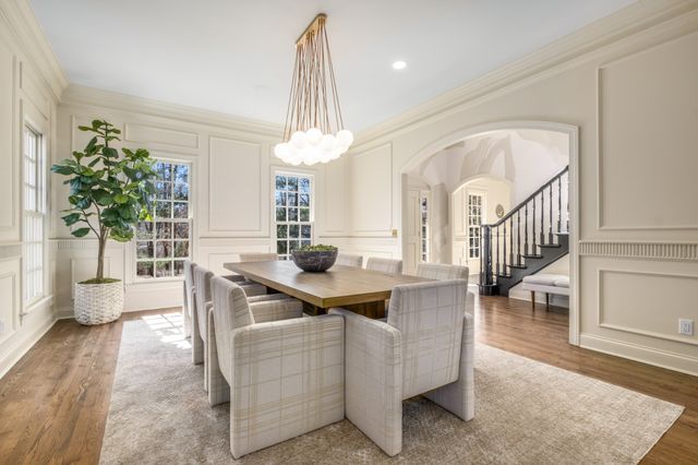 a view of living room with furniture and a chandelier