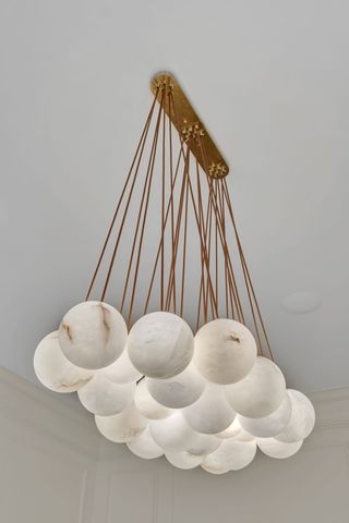 a bathroom with double sink and a mirror