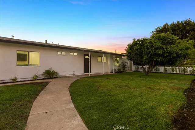 a house view with a garden space