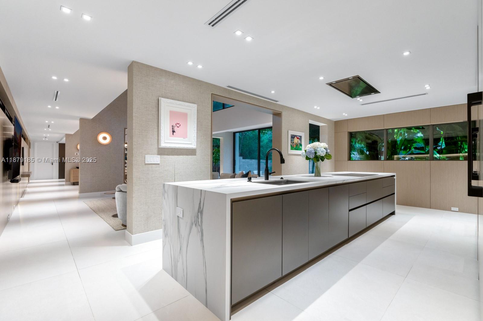 3651 St Gaudens Road Coconut Grove, FL 33133 - Photo 14 of 70 a kitchen with stainless steel appliances a sink and cabinets