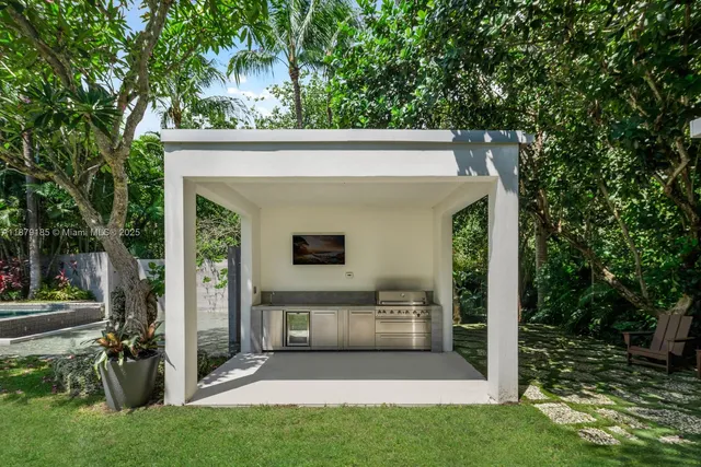 a lobby with furniture and garden view