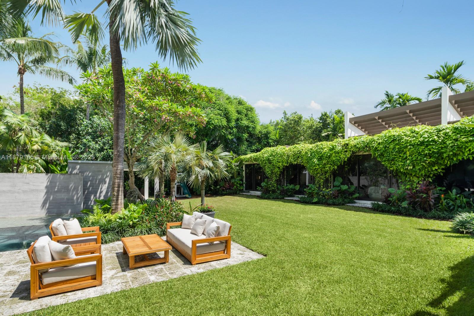 3651 St Gaudens Road Coconut Grove, FL 33133 - Photo 21 of 70 a view of backyard with seating space